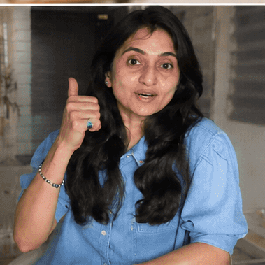 A FitWithPari coach giving a thumbs up on a live video call